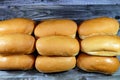 Hot dog bun is a type of soft bun shaped specifically to contain a hot dog or another type of sausage, small side-loading buns for