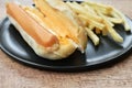 Hot dog with cheese and French fried fast food on dish Royalty Free Stock Photo