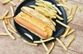 Hot dog with cheese and French fried fast food on dish Royalty Free Stock Photo