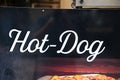 Hot-dog fast food restaurant text sign on wall facade entrance in street Royalty Free Stock Photo