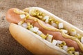 Hot dog grill with mustard, onion and pickles Royalty Free Stock Photo