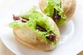 Hot dog. Grilled hot dogs with fresh salad lettuce on wooden table.