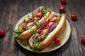 Hot dog. Grilled hot dogs with ketchup on a wooden table. Royalty Free Stock Photo