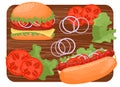 Hot dog and hamburger on a wooden cutting board. Ingredients for making a hot dog. Royalty Free Stock Photo