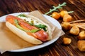 Hot dog with pickles and arugula and smoked beer snacks. Royalty Free Stock Photo