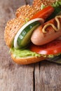Hot dog with sausage, vegetables and mustard macro Royalty Free Stock Photo