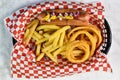 hot dog served with french fries and onion rings