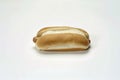 Hot dog is sitting on a bun Royalty Free Stock Photo