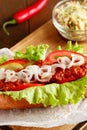 Hot-dog on wooden cutting board Royalty Free Stock Photo