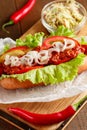 Hot-dog on wooden cutting board Royalty Free Stock Photo