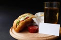 Hot Dogs with French fries and ketchup on wooden plate Royalty Free Stock Photo