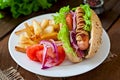 Hot Dogs with French fries on white plate. Royalty Free Stock Photo