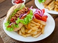 Hot Dogs with French fries on white plate Royalty Free Stock Photo