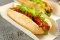 Hot dogs on grey wooden table, closeup. Fast food Royalty Free Stock Photo