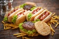 Hot dogs, hamburgers and french fries. Composition of fast food snacks