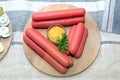 Hot dogs with mustard on a wooden board Royalty Free Stock Photo