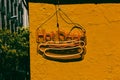 Hot dogs trendy LED sign against yellow wall. Fast food bistro, cafe exterior. Royalty Free Stock Photo