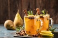 Hot Toddy. Mulled pear cider or spiced tea or grog Royalty Free Stock Photo