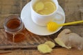 A hot drink for a cold. Autumn. disease. Health. Tea of lemon and ginger. Honey for treatment. Cup of green natural tea Royalty Free Stock Photo