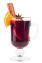 Hot drink mulled red wine with Christmas spices, orange slice, anise and cinnamon sticks in glass goblet isolated Royalty Free Stock Photo
