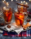 Hot drink for New Year, Christmas or autumn holidays. Mulled cider or spiced punch, tea or mulled white wine with lemon, apples, Royalty Free Stock Photo