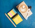 Hot drink with notebook on the table Royalty Free Stock Photo