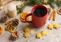 hot drink in red cup next to cookies and spices on the table. winter holidays, Christmas, New Year Royalty Free Stock Photo