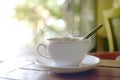 Hot drink with steaming of white cup on the wooden table Royalty Free Stock Photo