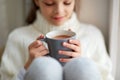 Girl with cacao mug looking at home window Royalty Free Stock Photo