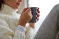 Girl with tea mug sitting at home window Royalty Free Stock Photo