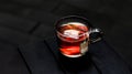 Hot Earl Grey Tea with tea bag served in a cup isolated on dark background side view Royalty Free Stock Photo