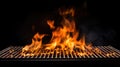Hot empty portable barbecue BBQ grill with flaming fire and ember charcoal on black background Royalty Free Stock Photo