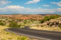 Long lonely road in the middle of the desert under the blue sky Royalty Free Stock Photo