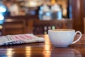 Hot espresso coffee cup with newspaper on wooden table lighting Royalty Free Stock Photo