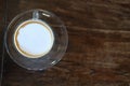 hot espresso macchiato coffee with milk topping in glass cup on Royalty Free Stock Photo