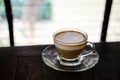 hot espresso macchiato coffee with milk topping in glass cup on Royalty Free Stock Photo