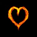 Hot fire heart burning on black background. Passion and desire Royalty Free Stock Photo