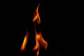 Hot flames on a black background. Beautiful flame of fire in the dark. Abstract of burning flames and smoke Royalty Free Stock Photo