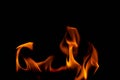 Hot flames on a black background. Beautiful flame of fire in the dark. Abstract of burning flames and smoke Royalty Free Stock Photo