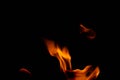 Hot flames on a black background. Beautiful flame of fire in the dark. Abstract of burning flames and smoke Royalty Free Stock Photo