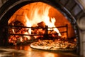 Hot Flames in Pizza Oven. Traditional Firewood Stone Wood Fired Pizza Oven