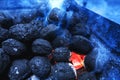 Hot flaming charcoal briquettes glowing in the barbeque grill pi Royalty Free Stock Photo