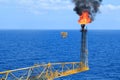 Hot flare boom and fire on offshore production platform Royalty Free Stock Photo