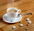 Hot fresh coffee in white cup with sugar on wooden table Royalty Free Stock Photo