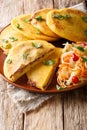 Hot fried pupusas served with curtido closeup on a plate. vertical Royalty Free Stock Photo