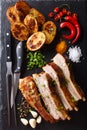 Hot fried ribs with baked potatoes and spices close-up. vertical Royalty Free Stock Photo