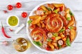 Hot fried sausages and potato on platter Royalty Free Stock Photo