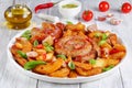 Hot fried sausages and potato on platter Royalty Free Stock Photo