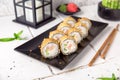 Hot fried Sushi Roll with shrimp, cucumber and cheese philadelphia. Sushi menu.