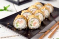 Hot fried Sushi Roll with shrimp, cucumber and cheese philadelphia. Sushi menu.